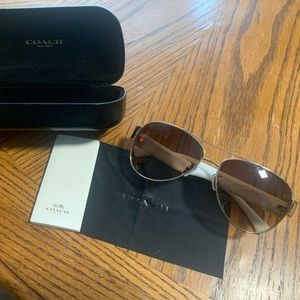 Coach, gold frame, brown Lens, white eith horse and carriage sunglasses